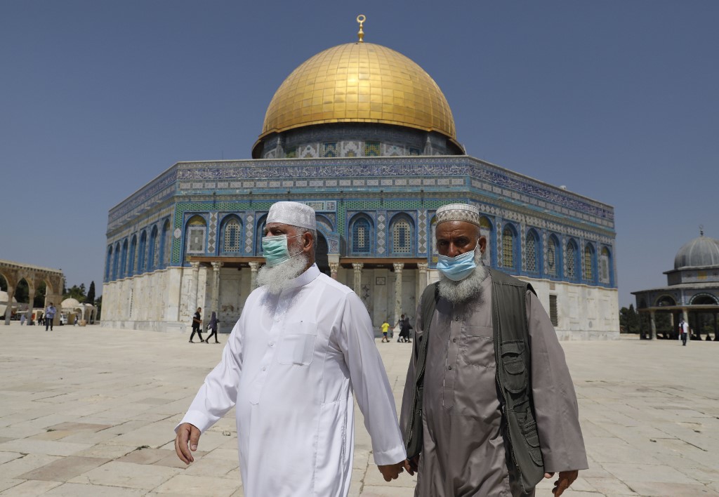 Palestinian Muslim worshippers wear face masks amidst the Covid-19 pandemic as they walk at the al-Aqsa mosque compound in the old city of Jerusalem on September 18, 2020. (File/AFP)