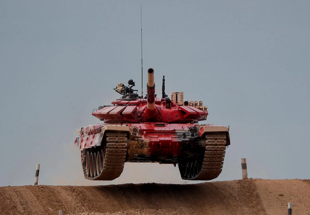 A T-72 B3 tank operated by a crew from Russia jumps during the Tank Biathlon competition at the International Army Games 2020 in Alabino, outside Moscow, Russia September 2, 2020. REUTERS/Maxim Shemetov
