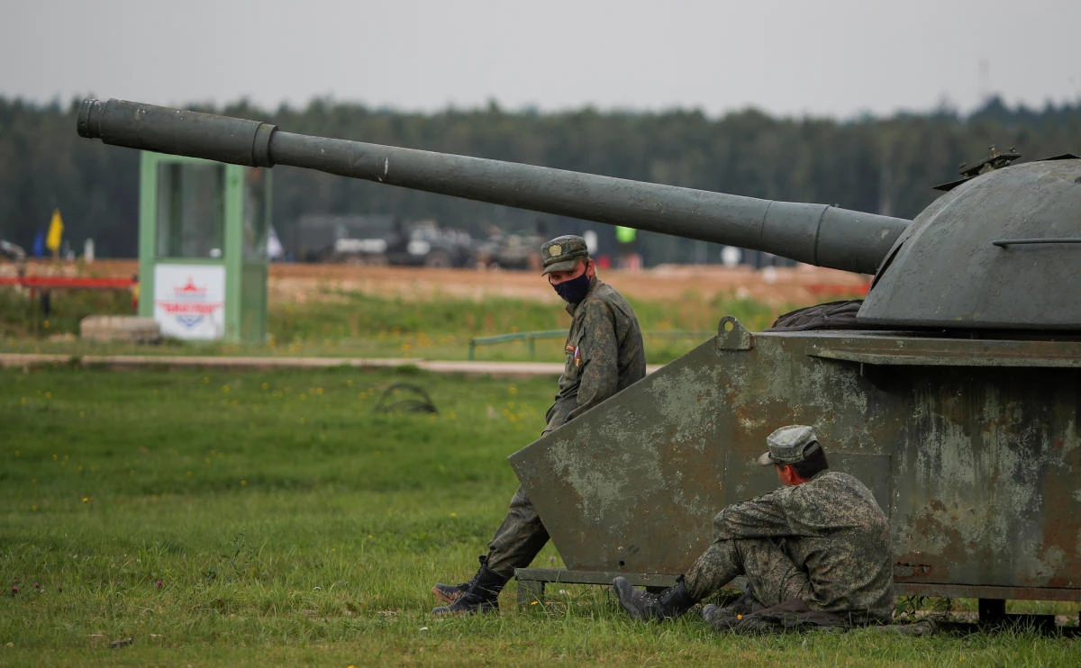 Russian servicemen rest during the Tank Biathlon competition at the International Army Games 2020 in Alabino, outside Moscow, Russia September 2, 2020. REUTERS/Maxim Shemetov
