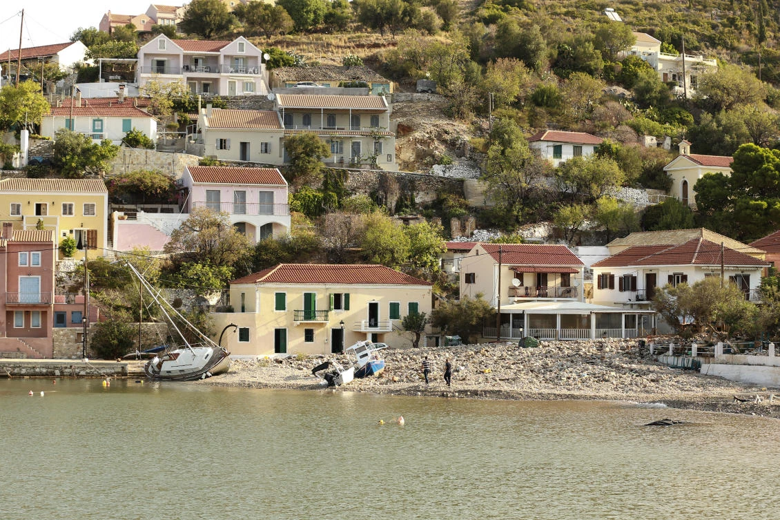 Boats are seen on a beach following a storm at the village of Assos, on the Ionian island of Kefalonia, western Greece, Sunday, Sept. 20, 2020. A powerful tropical-like storm named Ianos, battered parts of central Greece and some of the western Ionian islands, as emergency workers rescued more than 600 people. (AP Photo/Nikiforos Stamenis)