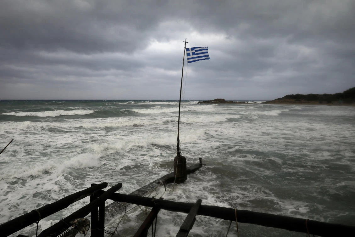 A Greek flag flatters in a beach near the town of Kyllini, as rare storm, known as a Medicane (Mediterranean hurricane), hit western Greece, September 18, 2020. REUTERS/Costas Baltas TPX IMAGES OF THE DAY