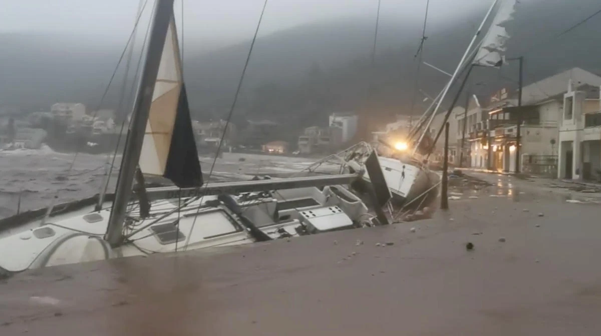 A boat leans towards a wall during storm Ianos in Agia Efimia, Kefalonia, Greece September 18, 2020, in this still image from a social media video. Apostolos Moustakis/via REUTERS THIS IMAGE HAS BEEN SUPPLIED BY A THIRD PARTY. MANDATORY CREDIT. NO RESALES. NO ARCHIVES.