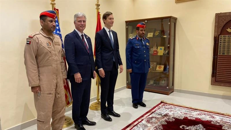 Jared Kushner, third from left, and US National Security Advisor Robert O'Brien, centre, pose for a group photo with UAE's Major General Falah Al-Qahtani, left, at Al-Dhafra airbase in Abu Dhabi. (AFP)