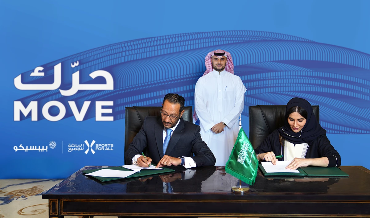 President of SFA Prince Khaled bin Alwaleed bin Talal overlooks the signing of the agreement by Shaima Saleh Al-Husseini of the SFA and Tamer Mosalam of PepsiCo.