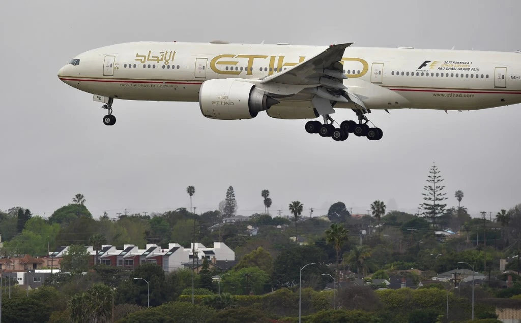 An Etihad flight landing in Abu Dhabi. Bahrain said all flights coming to and from the UAE capital could use its airspace. (AFP/File)