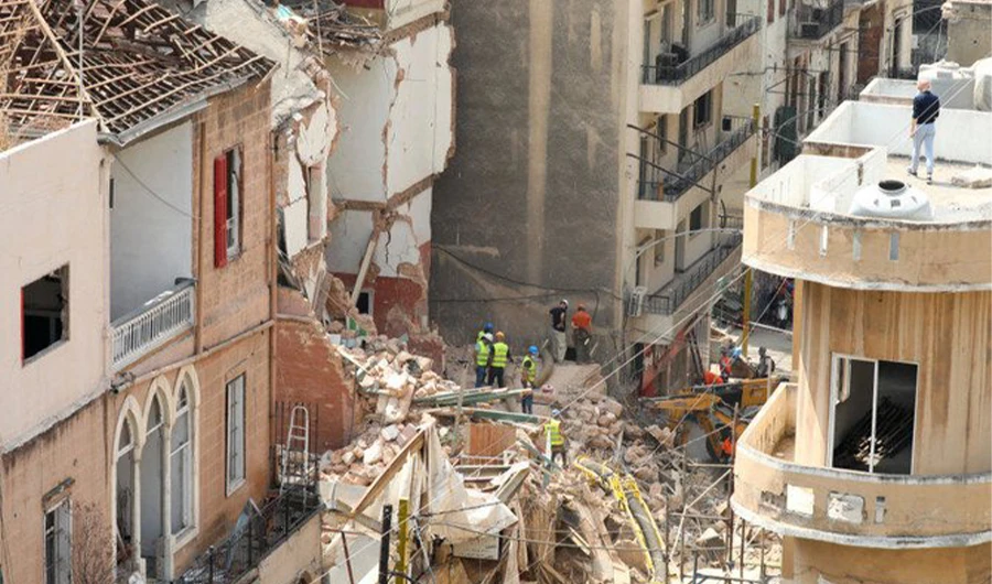 Volunteers and a Chilean rescue team member dig through the rubble of buildings which collapsed due to the explosion at the port area, after signs of life were detected, in Gemmayze, Beirut, Lebanon on Sept. 5, 2020. (REUTERS)