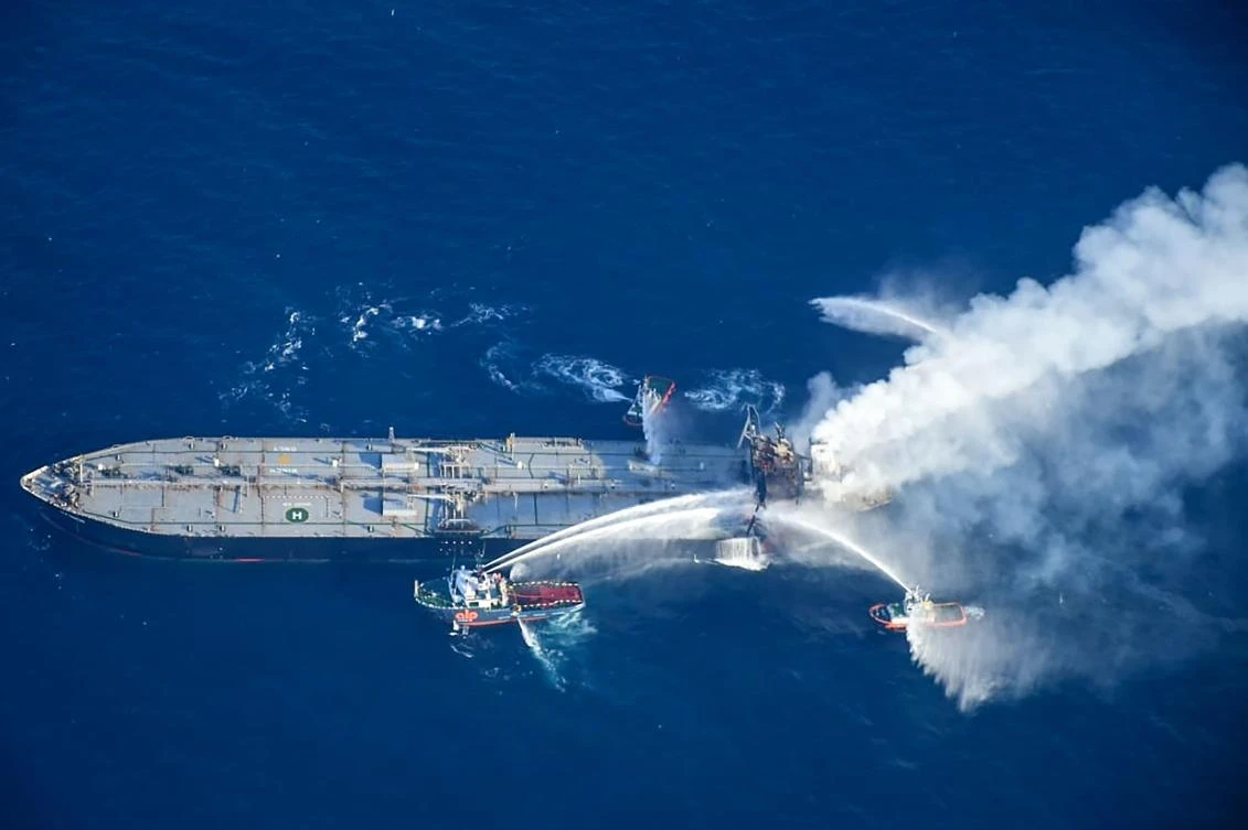 Fireboats battle to extinguish a fire on the Panamanian-registered crude oil tanker New Diamond, some 60 kms off Sri Lanka's eastern coast where a fire was reported inside the engine room. (AFP)