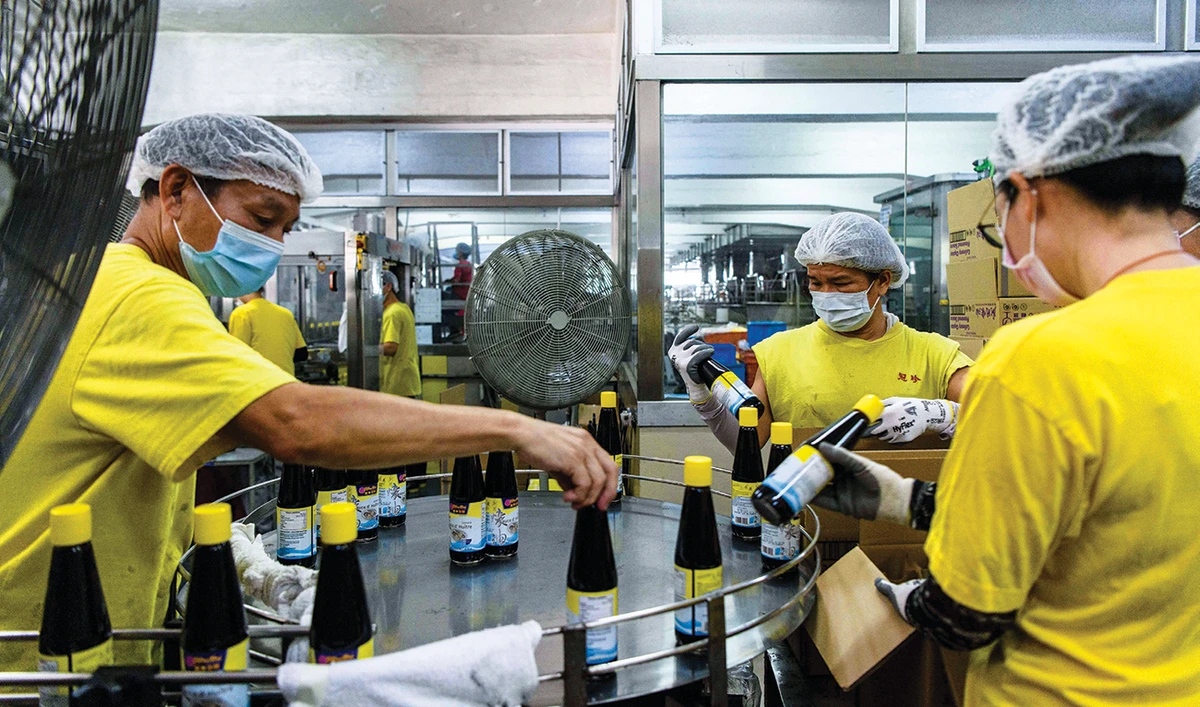 Worker sort bottles of soy sauce on a production line at the Koon Chun Sauce Factory in Hong Kong, which produces soy, hoisin and oyster sauces found in Chinese restaurants and kitchens around the world. (AFP)