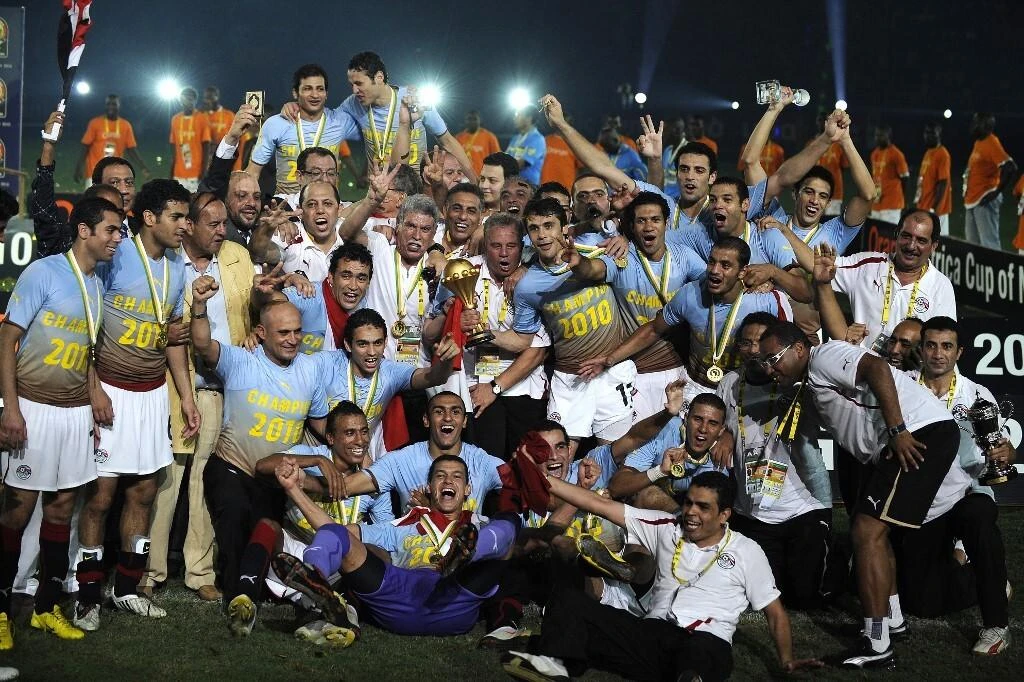 Egyptian team celebrates with CAF trophy during award ceremony after Egypt won over Ghana 1-0 during African Cup of Nations football championships CAN2010 at November 11 stadium in Luanda on January 31, 2010. (AFP/File Photo)