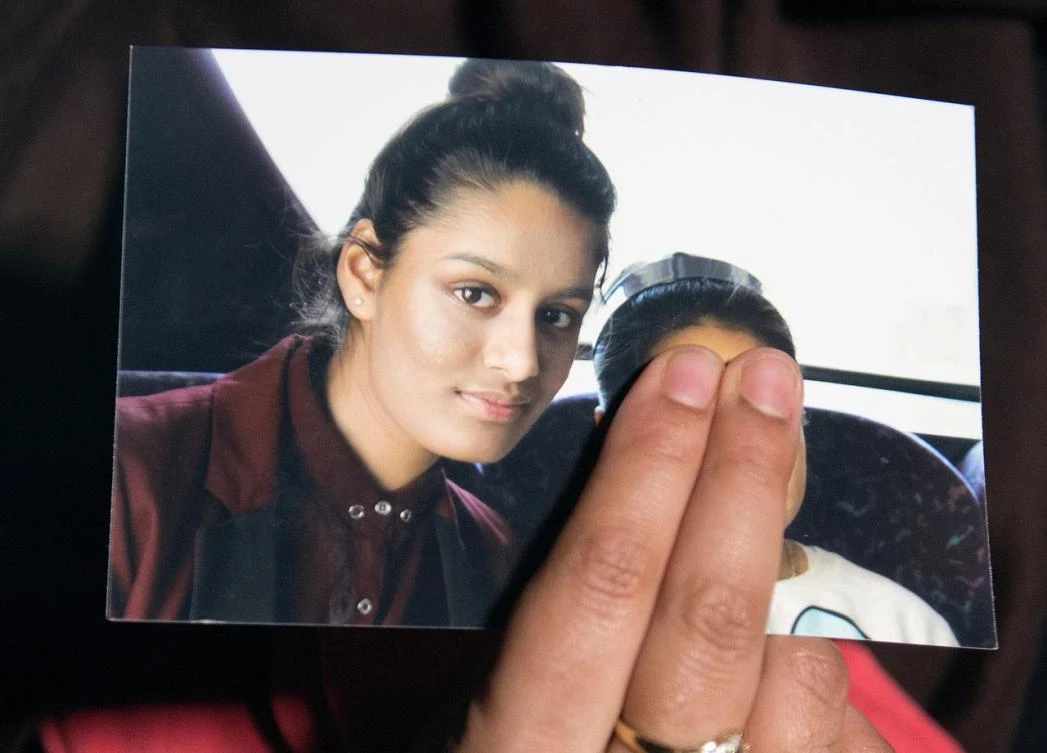 Sister of Shamima Begum holds her picture as she makes an appeal for her return at Scotland Yard, London. (Reuters)