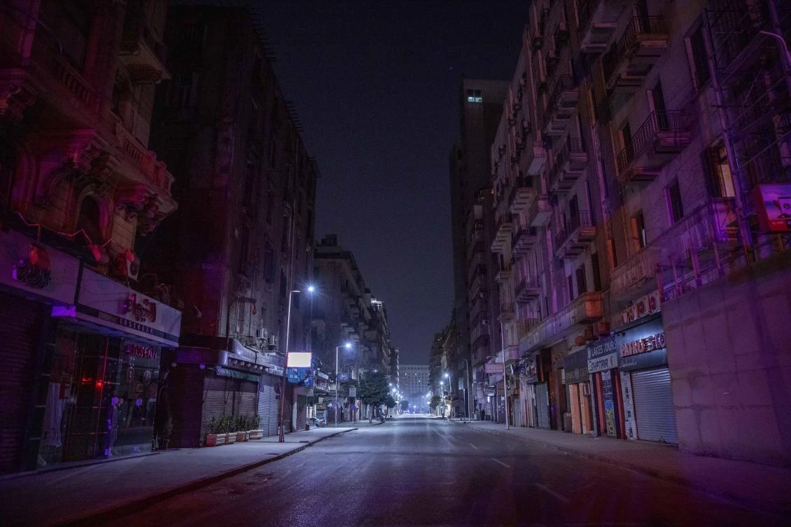 In this March 29, 2020, file photo, a street is empty during curfew hours due to the coronavirus outbreak, in Cairo, Egypt. Egyptian security forces have arrested two journalists, including one sick with COVID-19, the latest step in a sweeping crackdown on news media during the pandemic, an international press watchdog reported Friday, Sept. 4, 2020. (AP)
