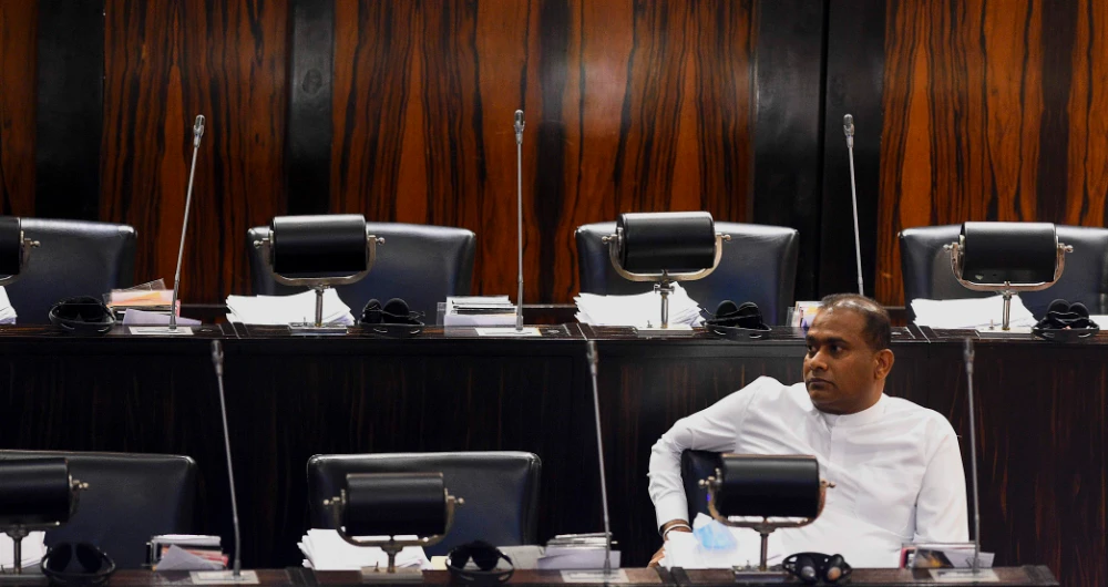 Sri Lanka's convicted murderer Premalal Jayasekara sits after swearing-in as a member of parliament from the ruling party in Colombo. (AFP)