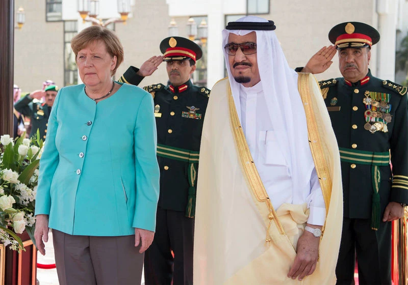 Saudi Arabia’s King Salman stands next to German Chancellor Angela Merkel during a reception ceremony in Jeddah, Saudi Arabia. (File/Reuters)