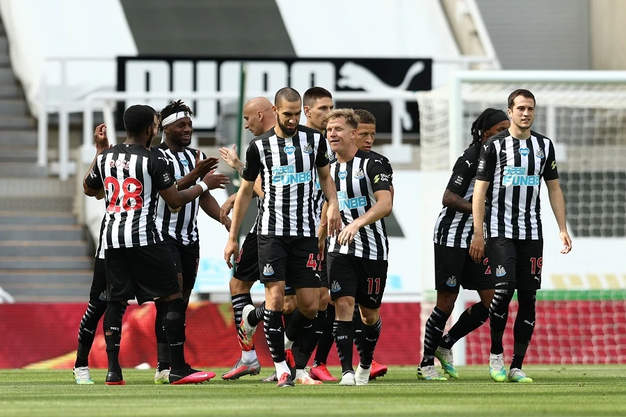 Newcastle United's English striker Dwight Gayle (C) celebrates with teammates after scoring a goal during the English Premier League football match between Newcastle United and Liverpool at St James' Park in Newcastle-upon-Tyne, north east England on July 26, 2020. (File/AFP)