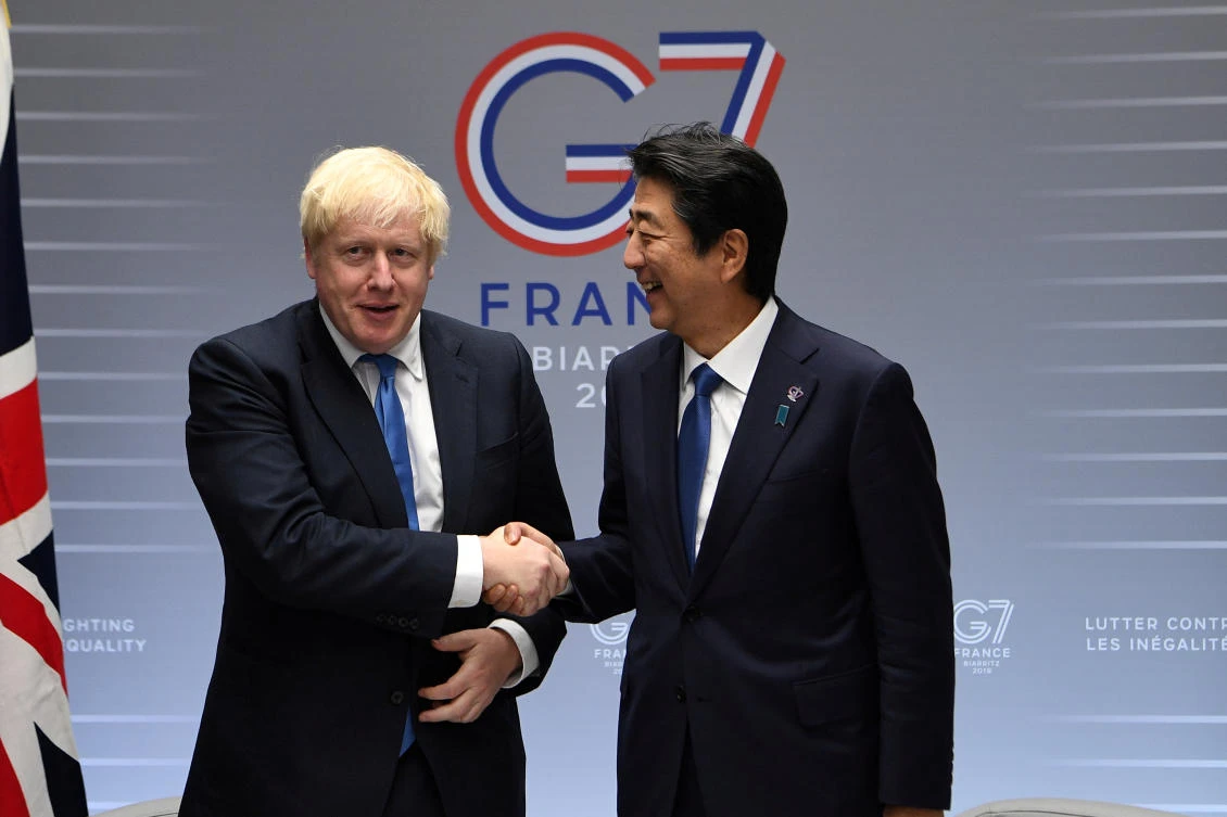 Britain's Prime Minister Boris Johnson meets with Prime Minister of Japan Shinzo Abe on day three of the G7 Summit in Biarritz, France, August 26, 2019. (Pool/File Photo)