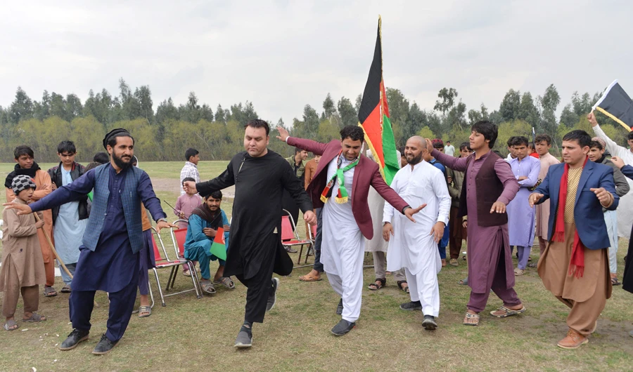 Afghan youths dance as they celebrate the reduction in violence in Jalalabad. The Taliban will hold talks with the Afghan government on Saturday. (File/AFP)