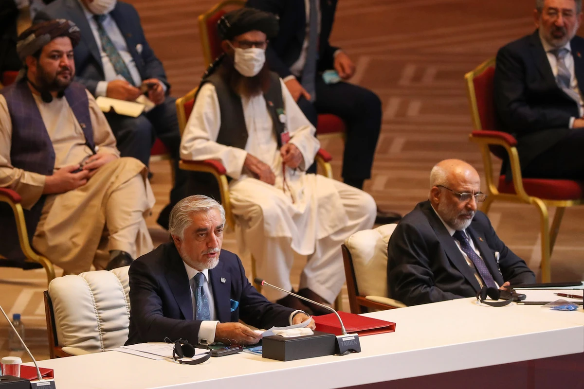 Abdullah Abdullah (L), Chairman of Afghanistan's High Council for National Reconciliation, speaks the opening session of the peace talks between the Afghan government and the Taliban in the Qatari capital Doha on September 12, 2020. (AFP)