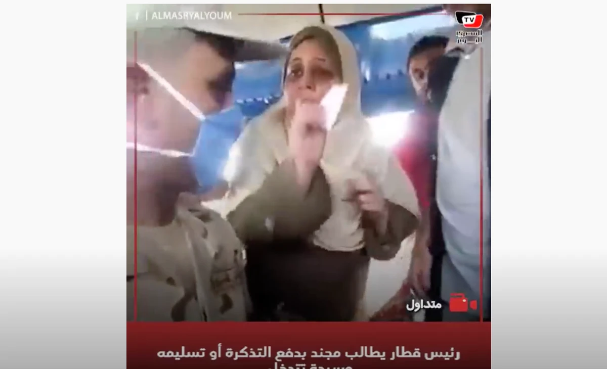A still taken from the video of the train lady and the conscript. (Published by Al-Masry El-Youm TV)