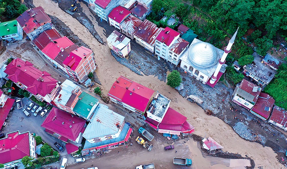 A residential area partially submerged by floodwaters in the province of Giresun in northern Turkey, where seven people died and others remain missing. (AFP)