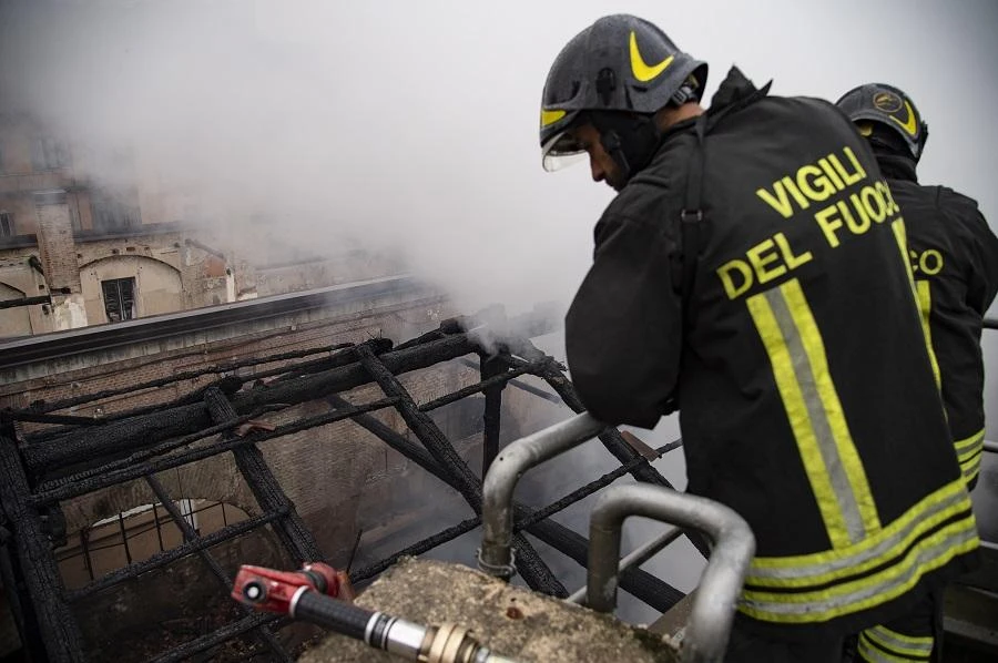 A firefighters intervenes by the building's rooftop that partially collapsed after a blaze occured early on October 21, 2019 at the UNESCO World Heritage Site "Cavallerizza Reale" in Turin. (File/AFP)