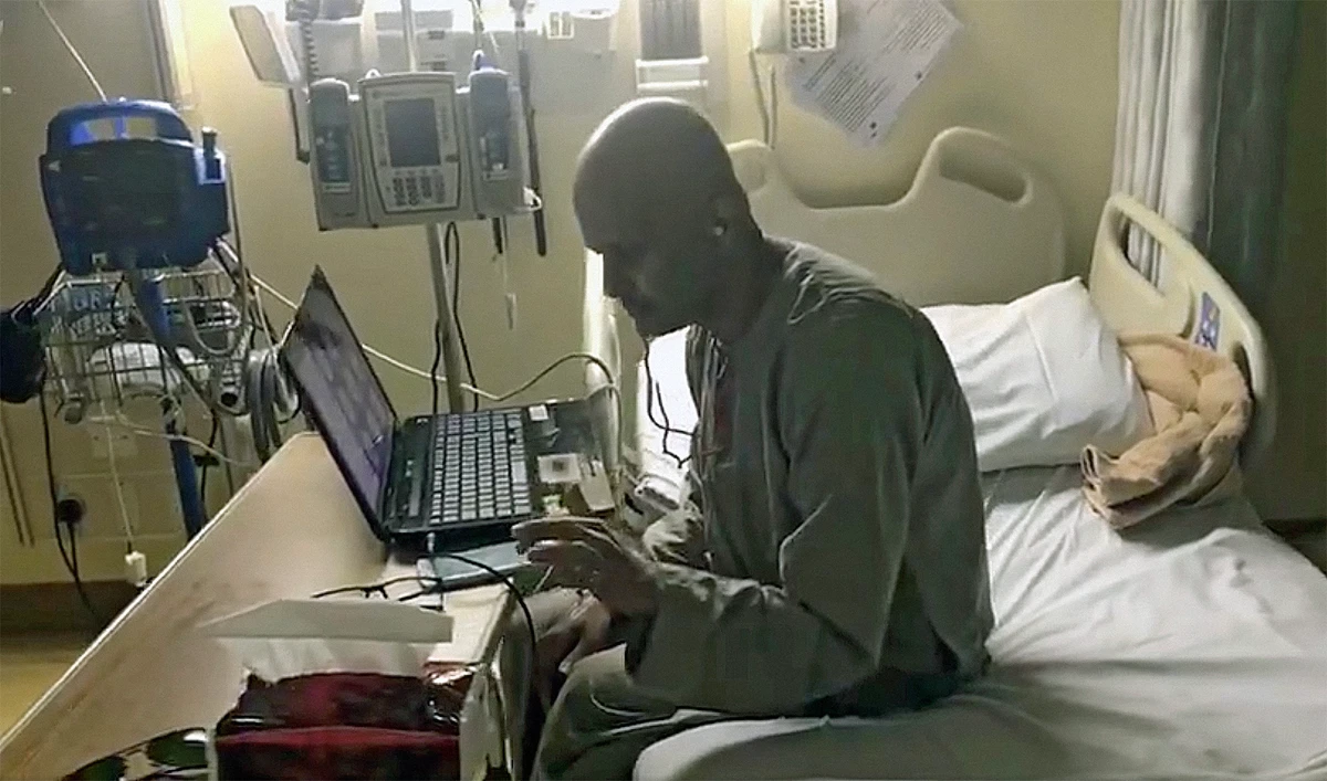 The screen grab taken from the viral video shows Mohammed Al-Fifi taking an online class from his hospital bed. (Photo courtesy: social media)