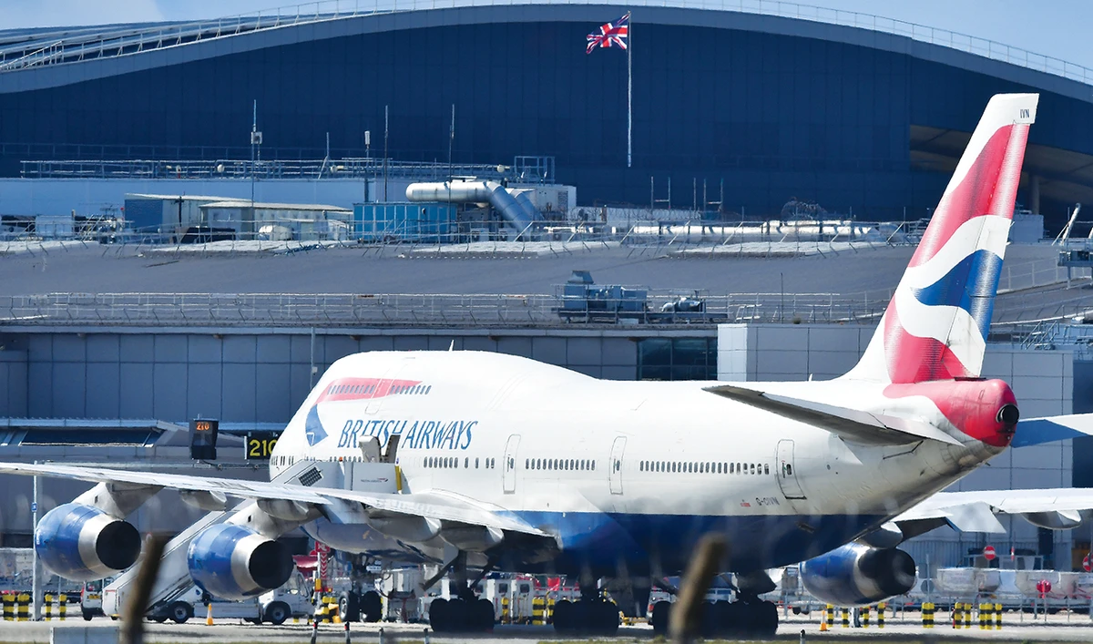 Flagship carrier British Airways is burning through £20 million a day and running only a third of normal services, according to its CEO. (AFP)