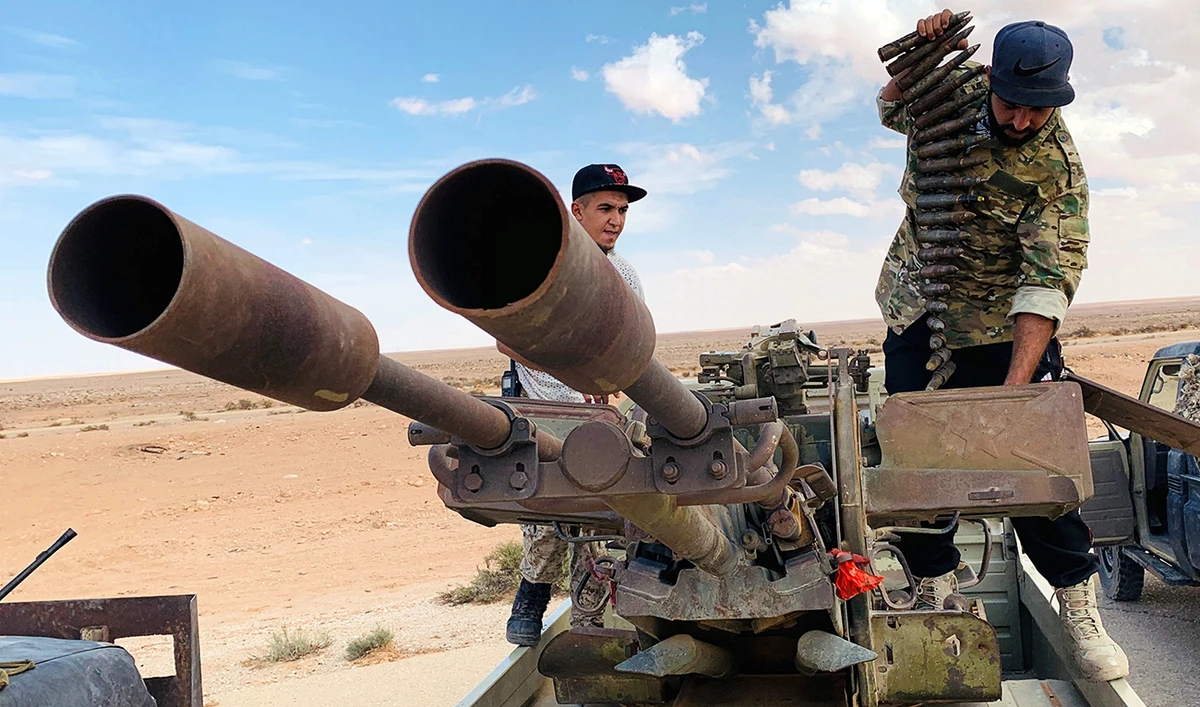 Troops loyal to the Tripoli government prepare their weapon as they carry out patrols in Zamzam, near Abu Qareen, Libya. (Reuters)