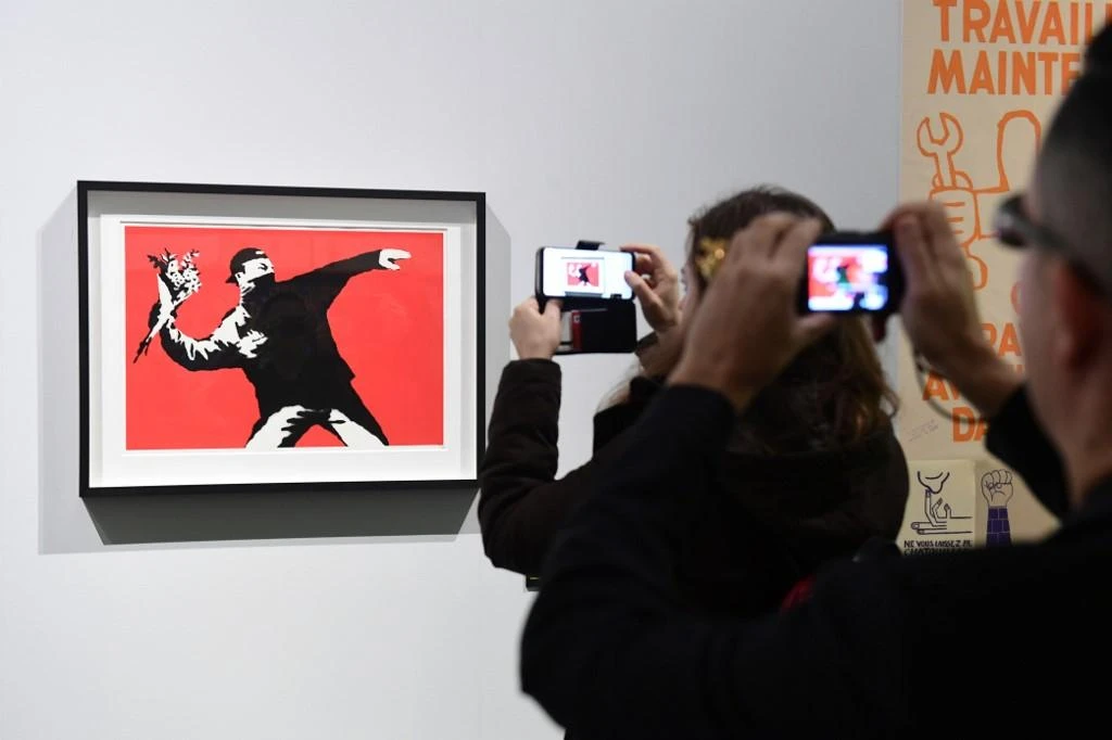 The cancellation division of the EU's intellectual property office declared Banksy's trademark for “Flower Thrower” invalid. (File/AFP)