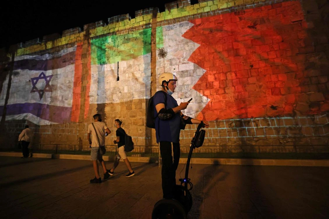 The flags of Israel, UAE, and Bahrain are projected on the ramparts of Jerusalem's Old City on September 15, 2020. (AFP)