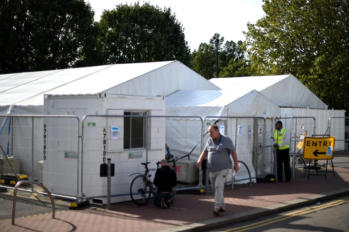 A security guard stands outside a Covid-19 test Centre in Leyton in east London on September 17, 2020. (AFP)