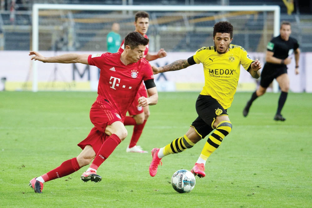 Bayern Munich’s Polish forward Robert Lewandowski, left, is still a key player for the team at 32. He scored 55 goals in 47 games last season. (AFP file photo))