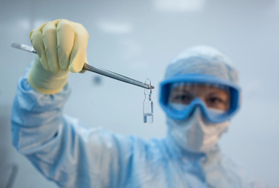 Above, an employee demonstrating a vial with “Gam-COVID-Vac” vaccine against the coronavirus disease during its production at Binnopharm pharmaceutical company in Zelenograd near Moscow on Aug 7, 2020. (Russian Direct Investment Fund via Reuters)