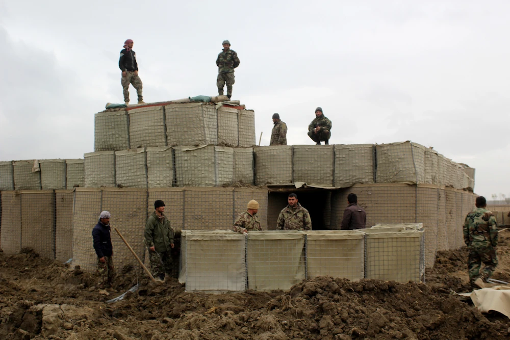Afghan security forces stand guard at an Afghan National Army (ANA) outposts in Kunduz Province. (File/AFP)