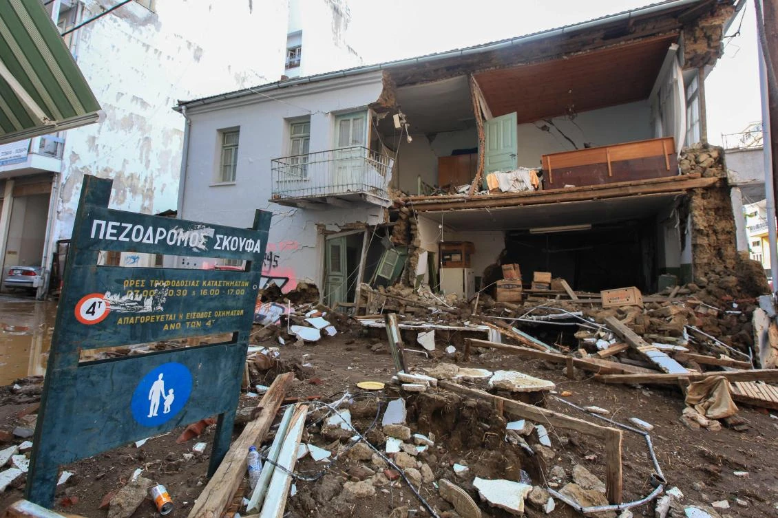 This picture taken on September 19, 2020, shows damages on a street and a house in Karditsa, central Greece, after the floods caused by the Mediterranean hurricane (Medicane) Ianos. Two people died and one was missing on September 19 after central Greece was lashed by a rare hurricane-like storm known as a “medicane.” Hundreds of people had to be rescued from flooded buildings as heavy rain and high wind wrecked homes, shops and warehouses in regions north of the capital Athens. (AFP)