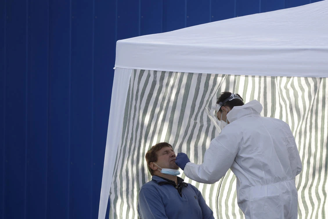 A man gets tested for COVID-19 at a sampling station in Prague, Czech Republic, Monday, Sept. 21, 2020. The country coped well with the first wave of the coronavirus infections in the spring but has been facing a record surge of the new confirmed cases last week. (AP)