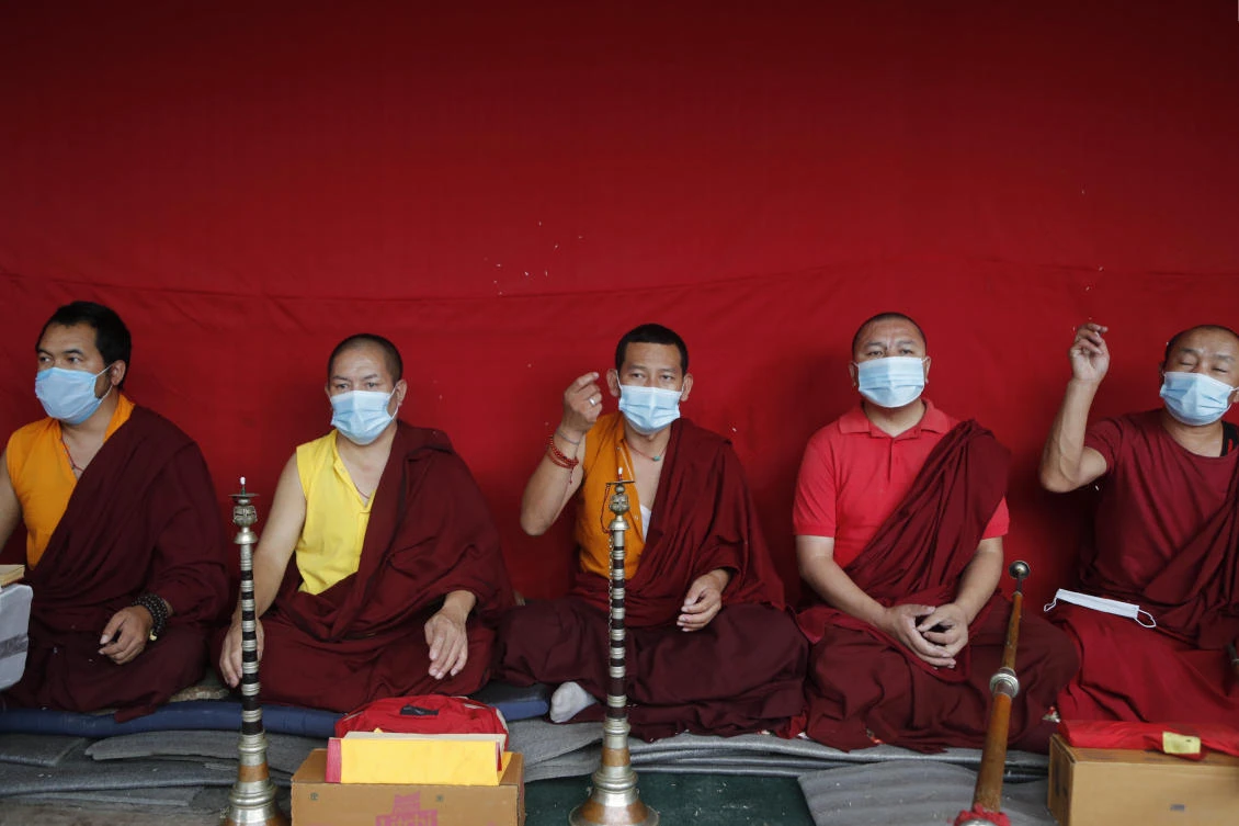 Buddhist monks perform rituals during the funeral of veteran Nepalese Sherpa guide Ang Rita, at Sherpa Monastery in Katmandu, Nepal, Wednesday, Sept. 23, 2020. Ang Rita, who was the first person to climb Mount Everest 10 times has died Monday at age 72 after a long illness. (AP)