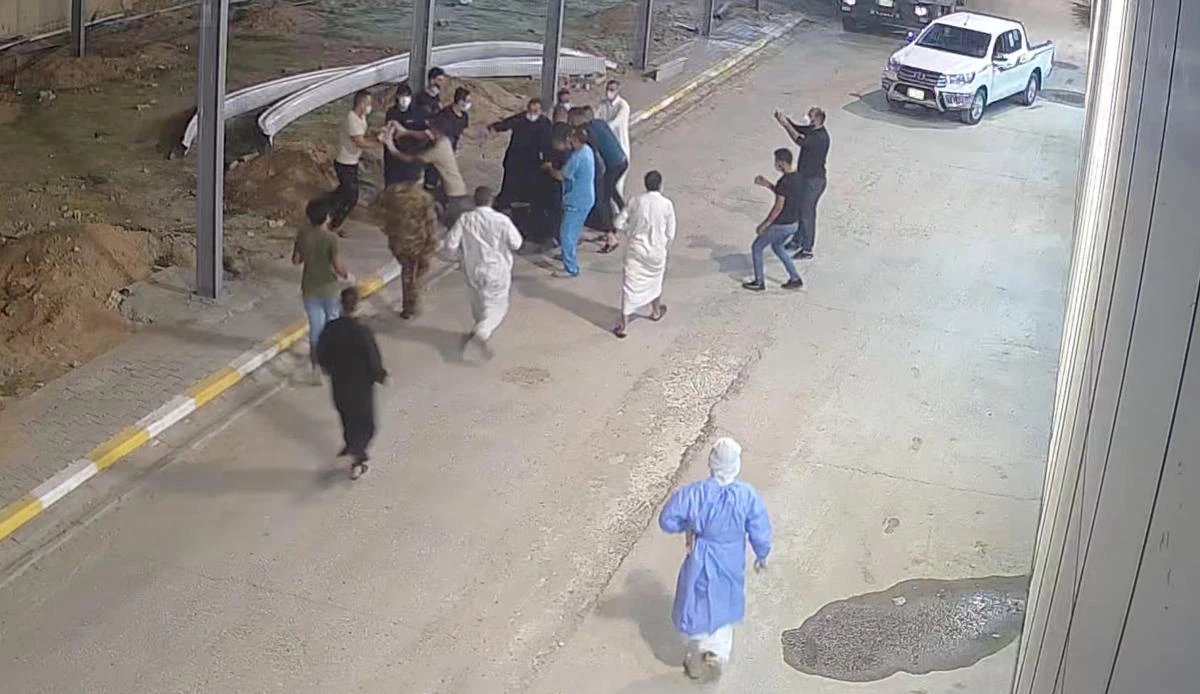 Relatives of a patient, who died from COVID-19, beat up Tarik Sheibani, 47, an Iraqi doctor and director of Al-Amal Hospital, in this still image taken from CCTV footage obtained by Reuters, in Najaf, Iraq August 27, 2020. (Reuters)