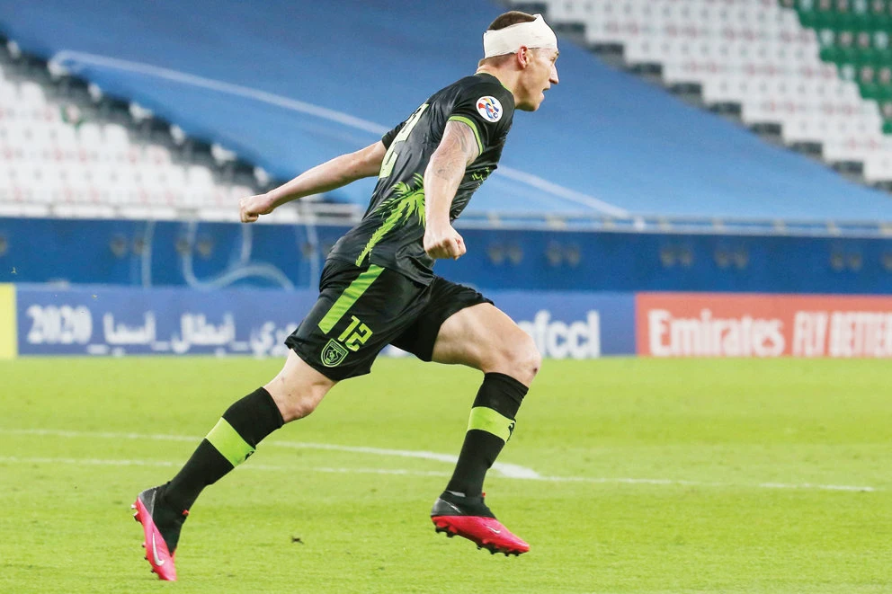 Al-Taawoun’s forward Mitchell Duke celebrates after scoring a goal during the AFC Champions League match against Al-Duhail. (AFP)