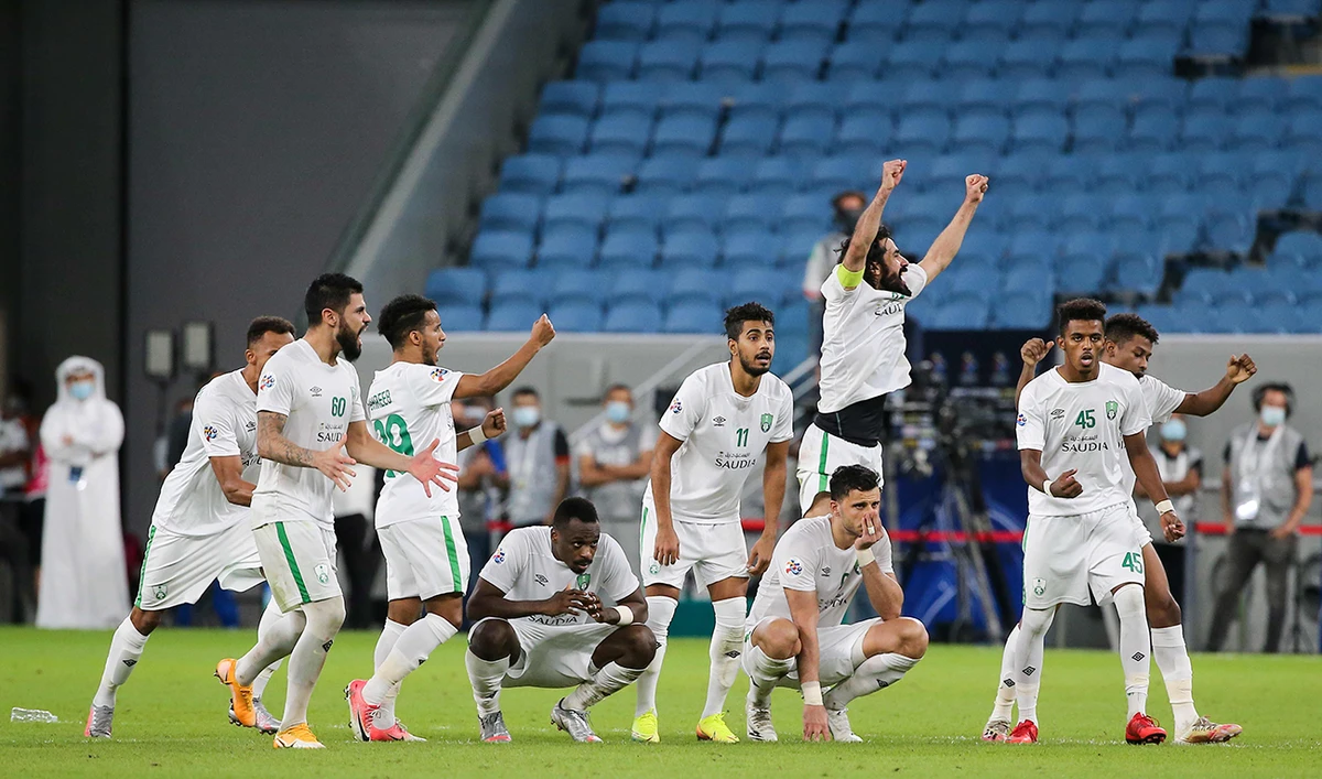 Ahli's players celebrate after winning the AFC Champions League Round of 16 match between Saudi's Al-Ahli and UAE's Shabab Al-Ahli on September 26, 2020, at the Al-Janoub Stadium in the Qatari city of Al Wakrah. (AFP)