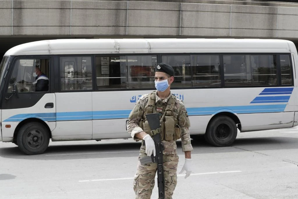 A Lebanese soldier, wearing a protective mask and gloves, stands guard at the Beirut international airport on April 5, 2020. (File/AFP)