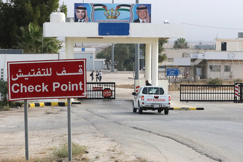 A vehicle arrives at the Jaber border crossing between Jordan and Syria (Nassib crossing on the Syrian side). Jordan reopened its trade gateway with Syria after month-long COVID closure. (File/AFP)