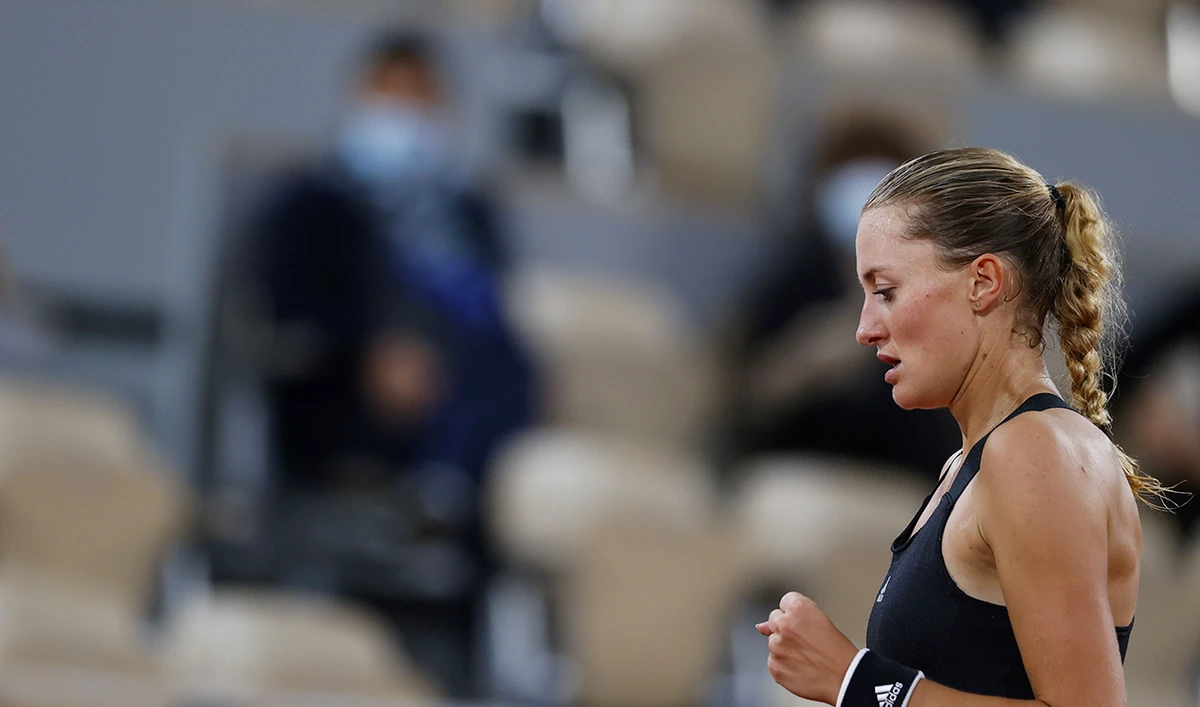 France's Kristina Mladenovic reacts as she plays against Germany's Laura Siegemund during their women's singles first round tennis match at the Philippe Chatrier court on Day 3 of The Roland Garros 2020 French Open tennis tournament in Paris on September 29, 2020. (AFP)