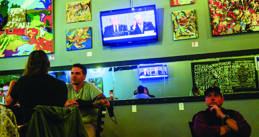 Viewers in Bloomington in the American state of Indiana watch US Republican President Donald Trump and Democratic opponent, former vice president, Joe Biden, during the first debate for the November election. (Getty Images)