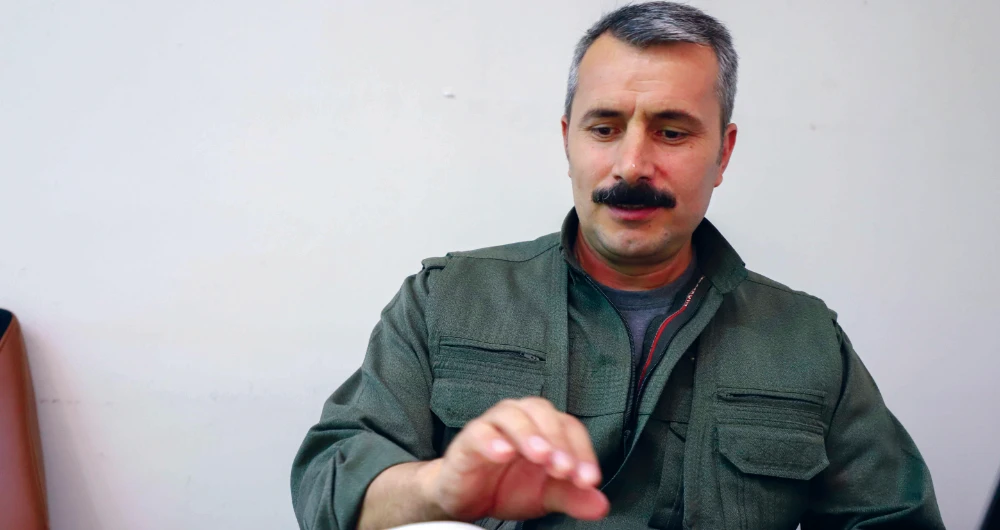 The spokesman of Turkey’s outlawed PKK, Zagros Hiwa, is seen during an interview with AFP in Qandil, the mountainous PKK stronghold in northern Iraq. (AFP)