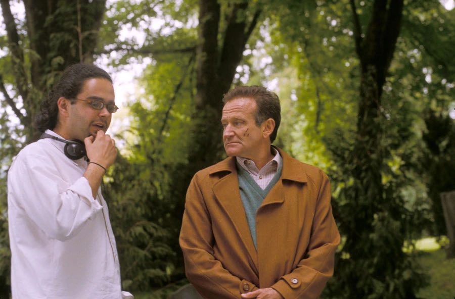 Omar Naim and Robin Williams on set. File/Alamy