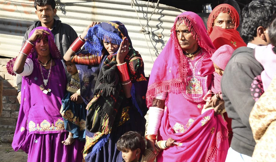 Pakistani Hindus board a bus for Jodhpur after arriving at the India-Pakistan Wagah border post, about 35 km from Amritsar, on Feb. 14, 2020. (AFP)