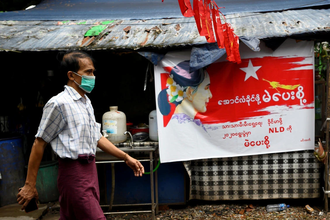A man wearing a protective face mask walks on the street amid the coronavirus disease (COVID-19) spread, in Yangon, Myanmar, October 2, 2020. (Reuters)