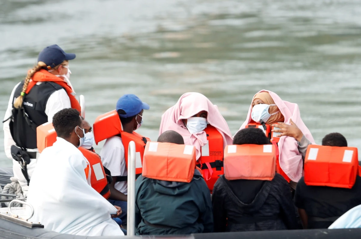 Migrants react as they are brought to Dover harbor by Border Patrol, in Dover, England. (Reuters/File Photo)
