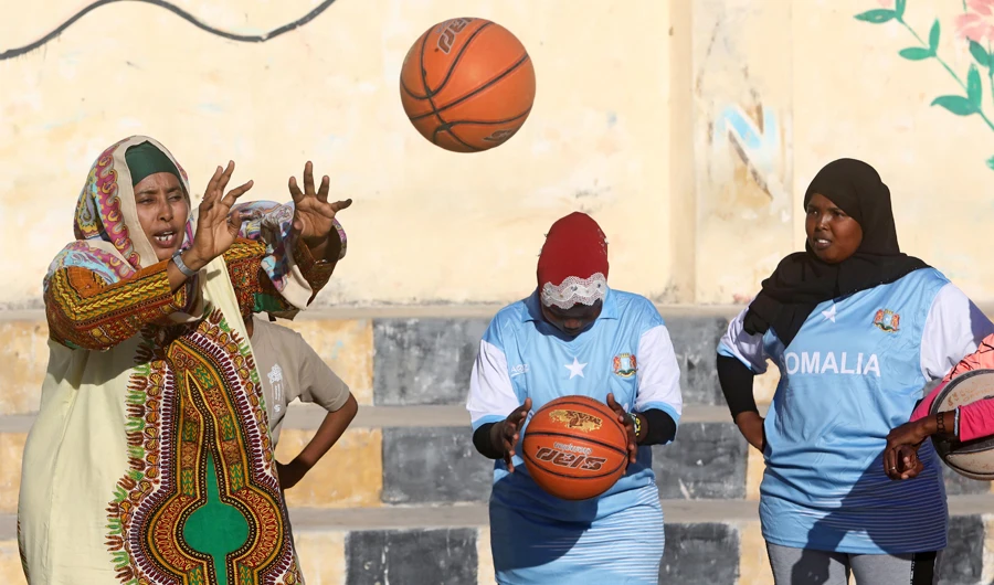 Former basketball player Nasra Mohamed leads Somali women during a basketball practice session at a court within Hamar Jajab district of Mogadishu, Somalia September 16, 2020. (REUTERS)
