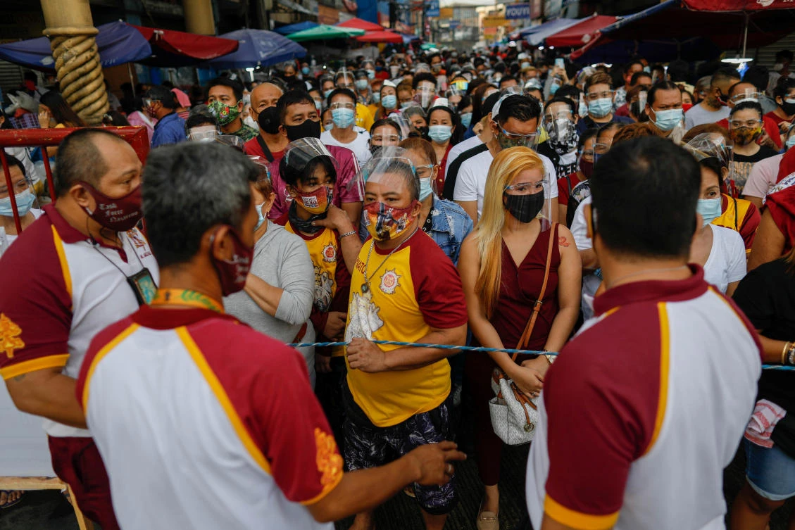 Coronavirus cases in the Philippines are highest in Southeast Asia as people have largely ignored social distancing norms such as when going to church, above. (Reuters)